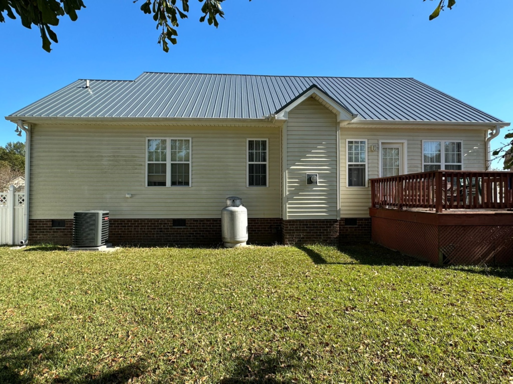 Metal Roof Components and Their Role in Your Home's Protection 1 A house with a metal roof