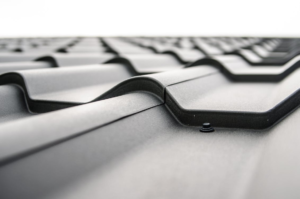 Metal roof panels joined with fasteners