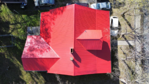 Aerial view of a red-colored roof after construction work has been completed.