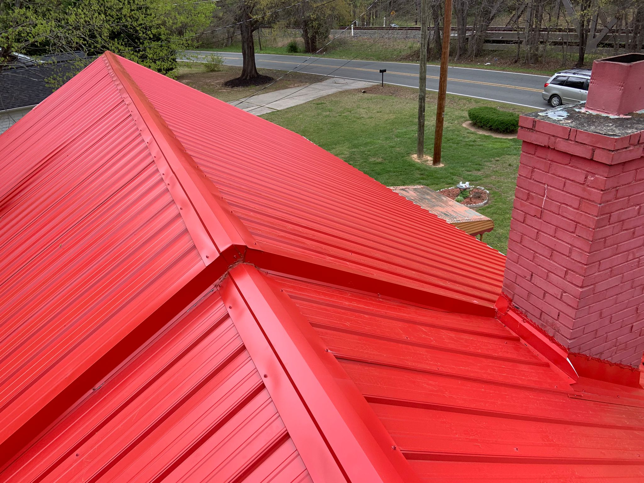 HeatShield Metal Roofing, Windows, and Doors for the Carolinas 1 A standing-seam metal roof in red color