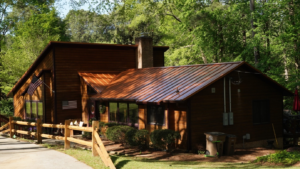 a beautiful home with a deep brown metal roof by Gator Metal Roofing