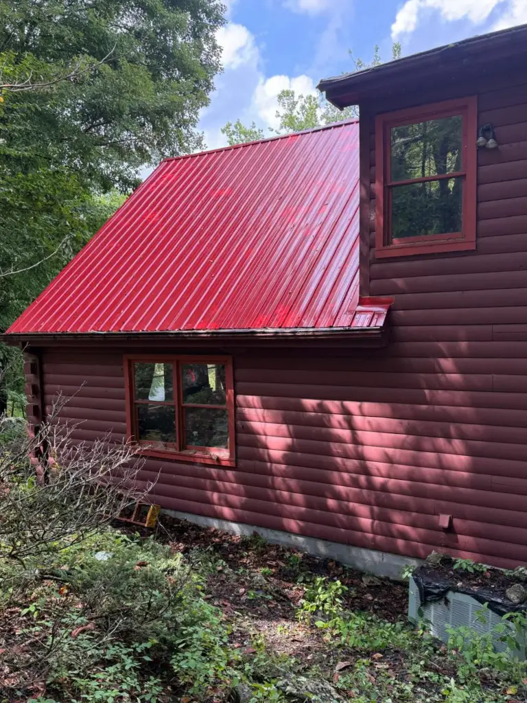 Red metal roofing from Gator on a log cabin in North Carolina.