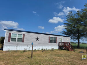 Black metal roofing on a mobile home in North Carolina.