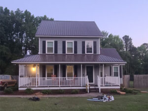 Bronze metal roofing on a two-story home in Angier, NC.