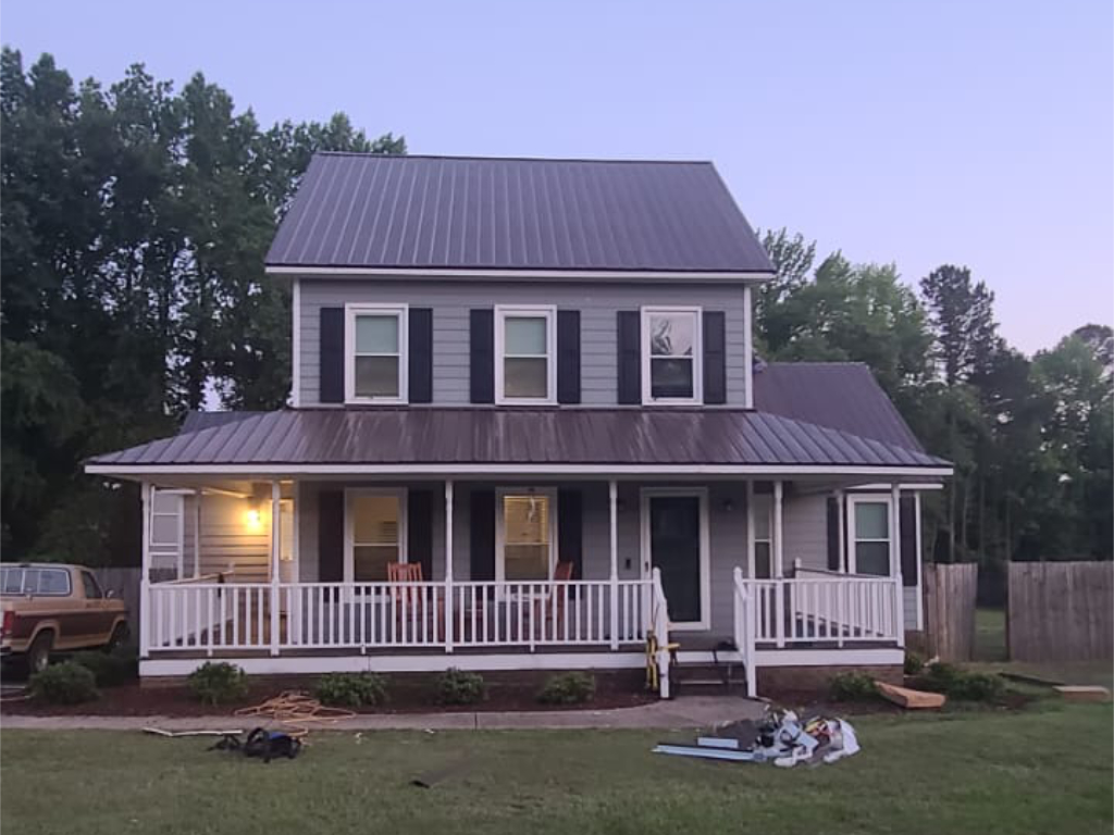 Bronze metal roofing on a two-story home in Angier, NC.