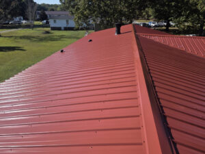 Center rooftop view of country red metal roofing on a home in Lillington, NC.