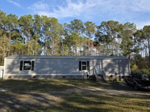Dark gray metal roofing on a southern home in Supply, North Carolina.