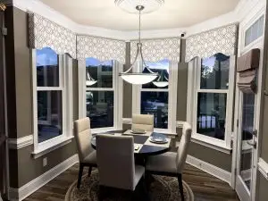 Post installation view of a breakfast nook with the HeatShield 5000 Double Hung Windows in Mount Pleasant, SC.