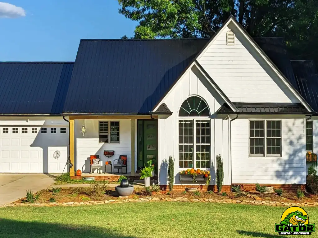 Completed installation of Gator's HeatShield Metal Roofing System in glossy black on a fall-themed Carolina home.