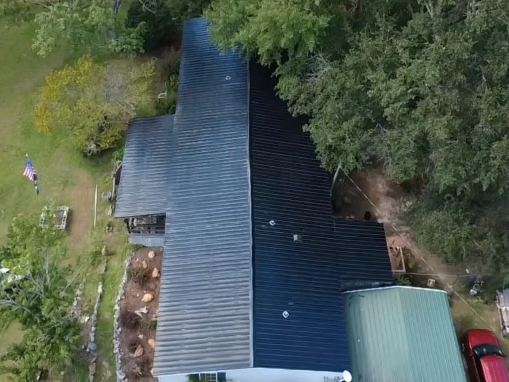 Alternate drone view of black metal roofing on a Lugoff, SC home from Gator Metal Roofing.