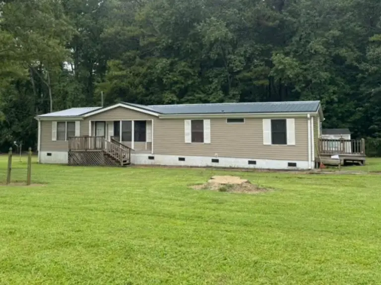 Completed installation of Gator's Gun Barrel Gray metal roofing in Siler City, NC.