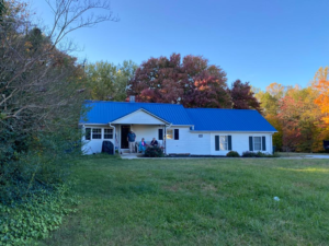 House with blue metal roof